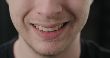 closeup shot of man mouth smiling, wide photoの写真素材
