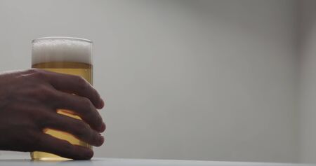 man hand take glass of cider with copy space, wide photoの写真素材