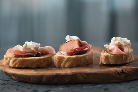 Bruschetta with panchetta, ricotta and fig jam, shallow focusの写真素材