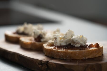 Bruschetta with ricotta and fig jam, shallow focusの写真素材