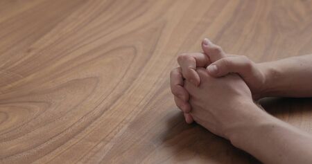 man hand waiting on black walnut table, wide photoの写真素材