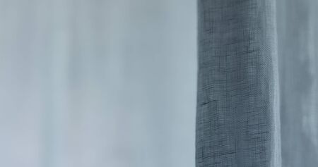 closeup of linen transparent curtains with cold light, wide photo