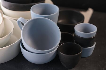 Matt ceramic handmade tableware in a workshop closeup, shallow focusの写真素材