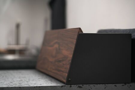 Walnut and black steel bread box with copy space, shallow focusの写真素材