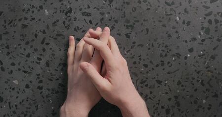 top view man hand fingertapping nervous waiting on concrete background, wide photo