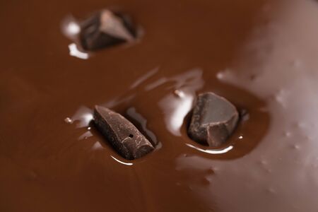 poured melted dark chcolate background closeup, shallow focusの写真素材