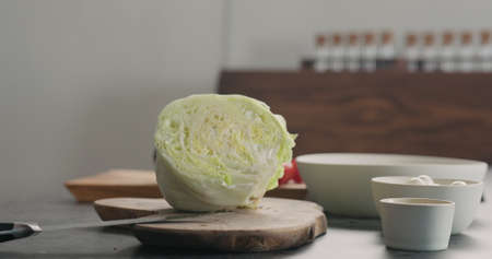 iceberg lettuce on wood board, wide photoの写真素材