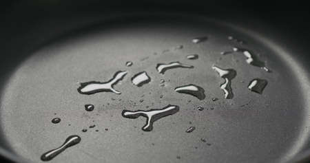 Non stick pan surface with oilの写真素材