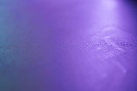 macro shot of decorative concrete surface with cyan and purple light