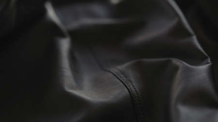 soft gray leather jacket waves background