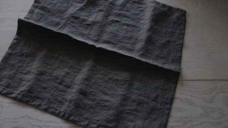seving oak table with linen napkinの写真素材