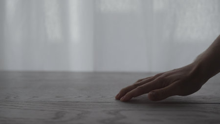 man hand touch white oak tableの写真素材