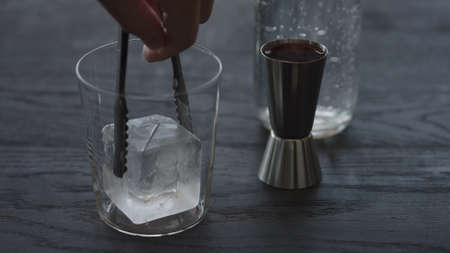 Making non alcohol spritz drink in a tumbler glass