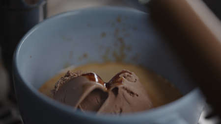 Making affogato with chocolate ice cream in blue cupの写真素材