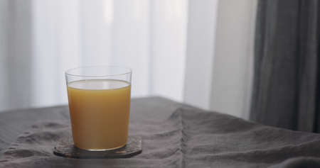 orange juice in tumbler glassの写真素材