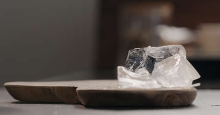 ice rocks on olive wood board