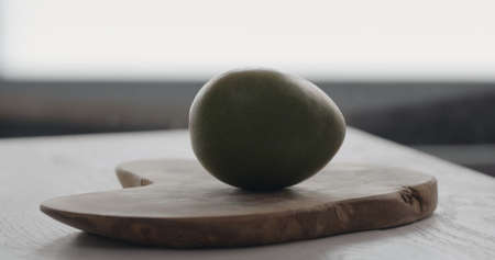 ripe mango on olive wood boardの写真素材
