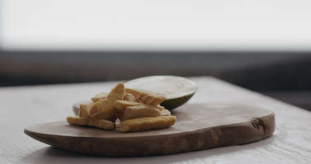 freeze dried mango on olive wood boardの写真素材