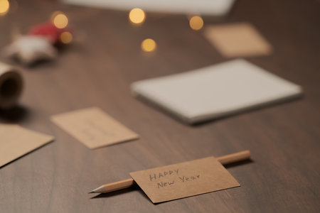 Happy new year paper cards on walnut table closeupの写真素材