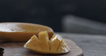 served thailand mango on olive board closeupの写真素材
