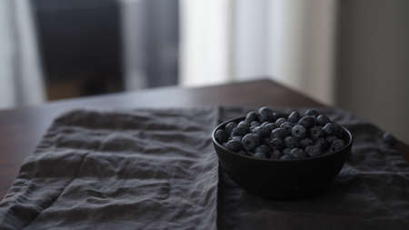 fresh blueberries in black bowl on table