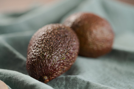 Two avocados on linen clothの写真素材