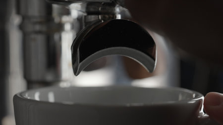 rinsing coffee machine with double spout portafilter closeupの写真素材