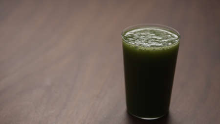 matcha drink in tumbler glass on tableの写真素材