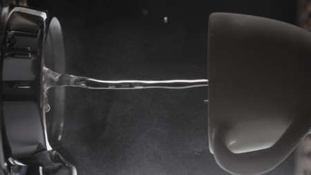 shot rinsing coffee machine with bottomless portafilter closeupの写真素材