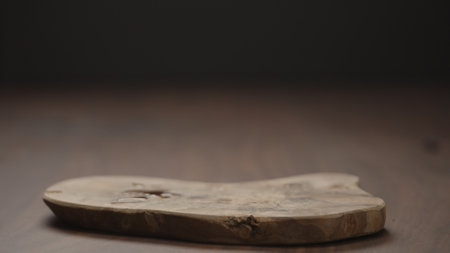 Empty olive cutting board on wood tableの写真素材
