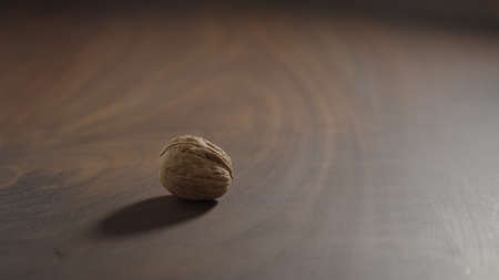 man spin walnut on walnut tableの写真素材