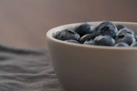 Fresh washed blueberries in white bowl closeupの写真素材