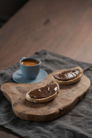 Toasted ciabatta with chocolate hazelnut spread and fresh espressoの写真素材