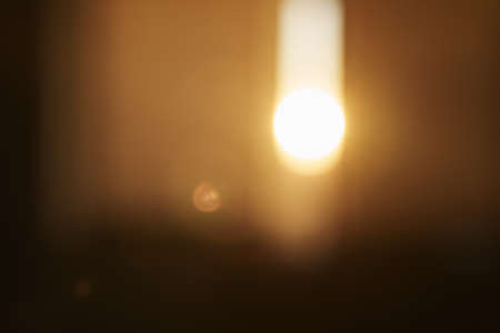 Defocused indoor background with sunset light