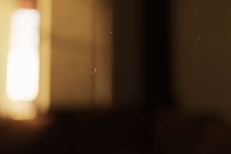 Defocused indoor background with sunset light