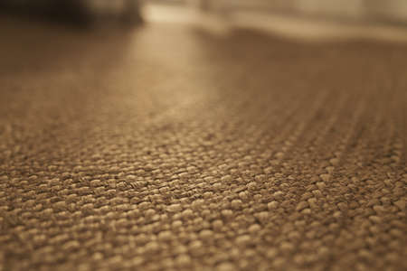 Closeup shot of jute rug on a floorの写真素材