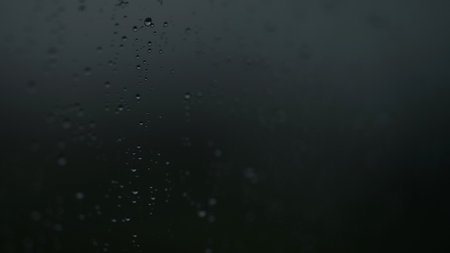 Real background of rain hitting glass with protective coatingの写真素材