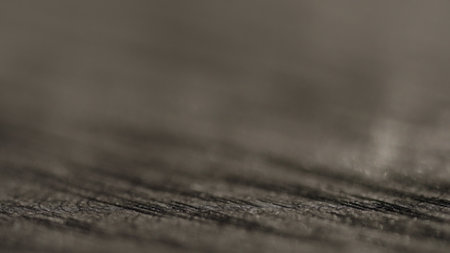 shot of black oak wood surface with light patternの写真素材