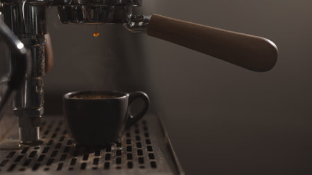 dark early morning shot of coffee machine making esprressoの写真素材
