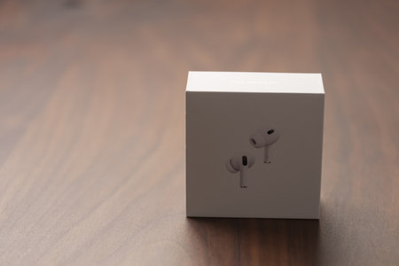 Saint-Petersburg, Russia - Circa December, 2022: Apple AirPods Pro 2nd generation box photo on walnut tableのeditorial素材