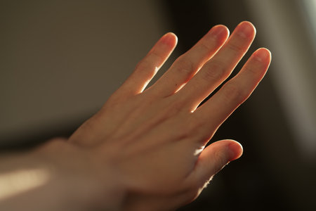 Abstract man hand playing with sunset light indoor
