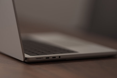 Saint-Petersburg, Russia - Circa December, 2022: open apple macbook pro 14 inch on walnut tableのeditorial素材