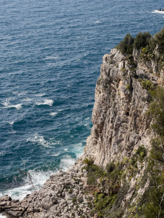 mediterranean sea waves smashing on rocks of Cote dazurの写真素材