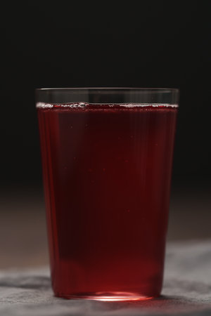 berry drink in thin glass on wood tableの写真素材