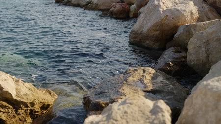 Azure waves of mediterranean sea splashing on French Riviera coast