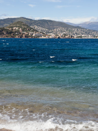 Azure sea coast on South of France with reddish plage