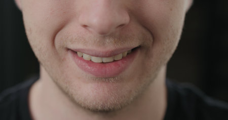 closeup shot of man mouth smilingの写真素材