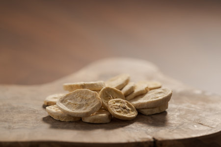 freeze dried banana chips on olive boardの写真素材