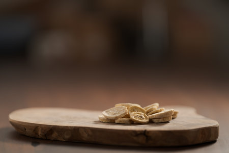 freeze dried banana chips on olive boardの写真素材