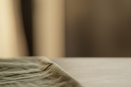 linen napkin on a wood table closeup with evening sunlightの写真素材